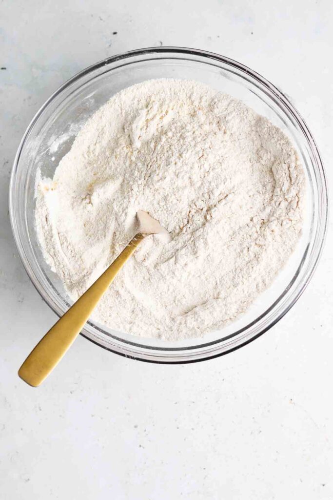 cassava flour mixed with sea salt and garlic powder in a bowl with a fork
