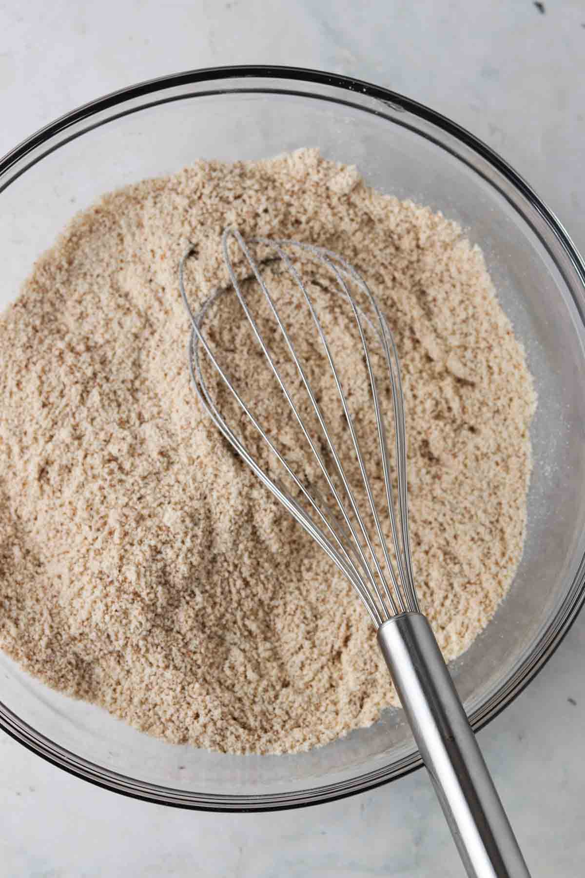 Dry cupcake ingredients in a glass mixing bowl.