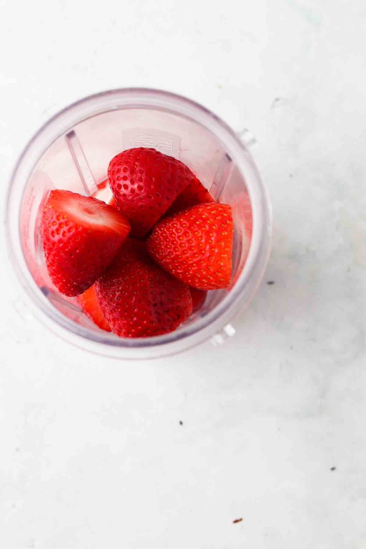 Strawberries in a food processor.