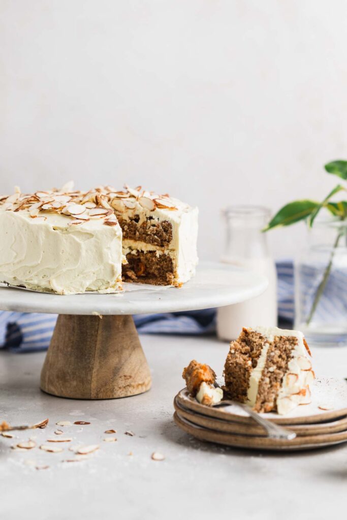 slice pulled out of the carrot cake