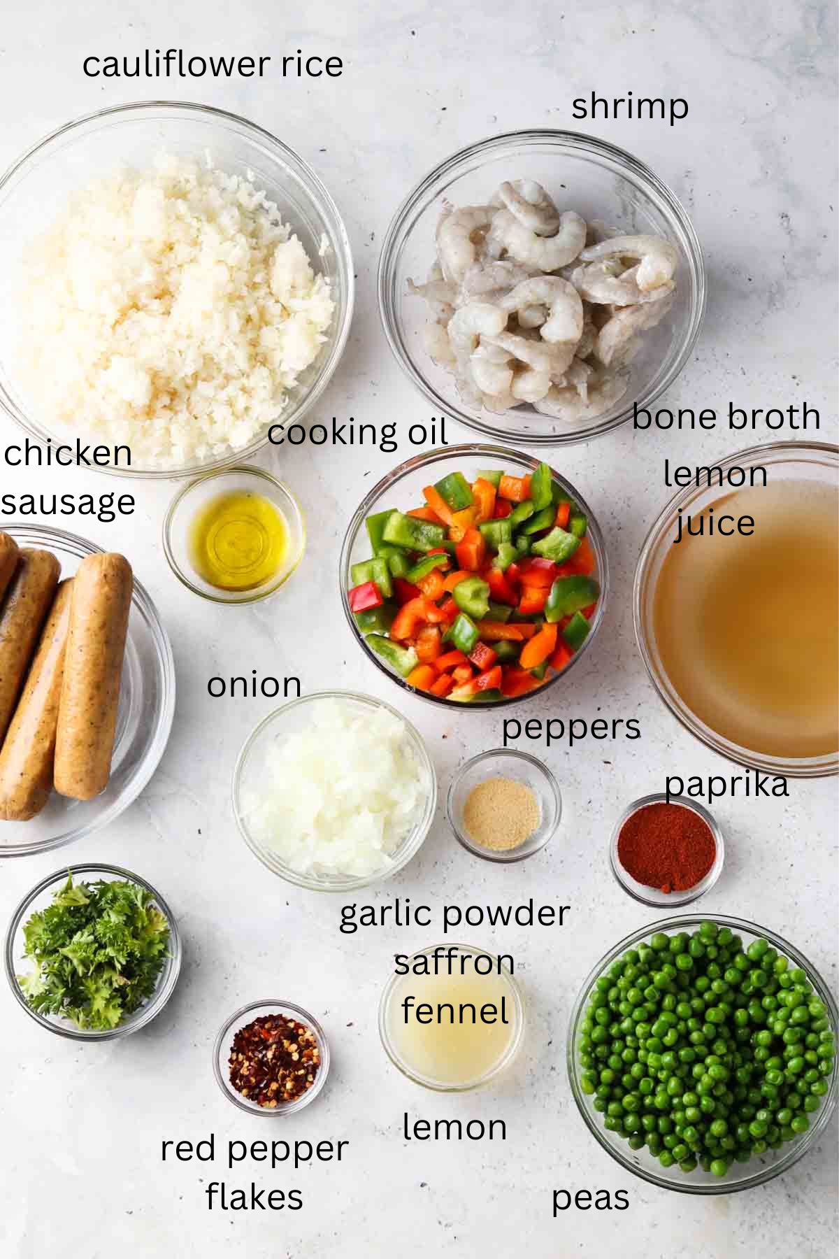 Recipe ingredients in small glass bowls laid out on the counter. 