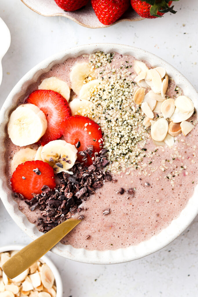 close up strawberry banana smoothie bowl