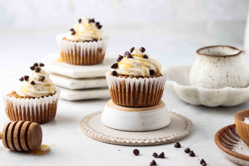 3 paleo cupcakes laid out with chocolate chips on top