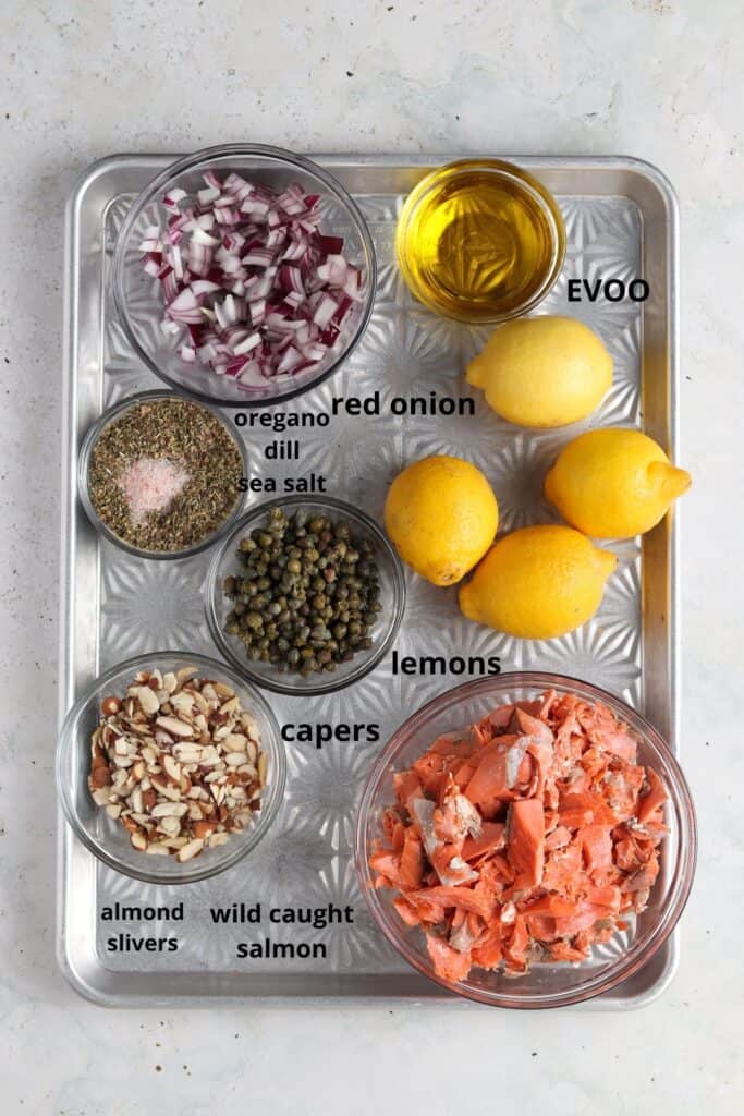 shredded lemon dill salmon salad ingredients on metal tray