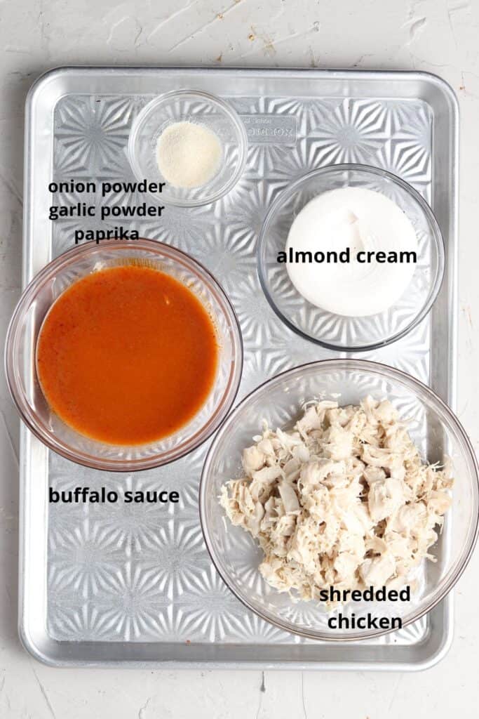 dairy free buffalo chicken dip ingredients on a tray