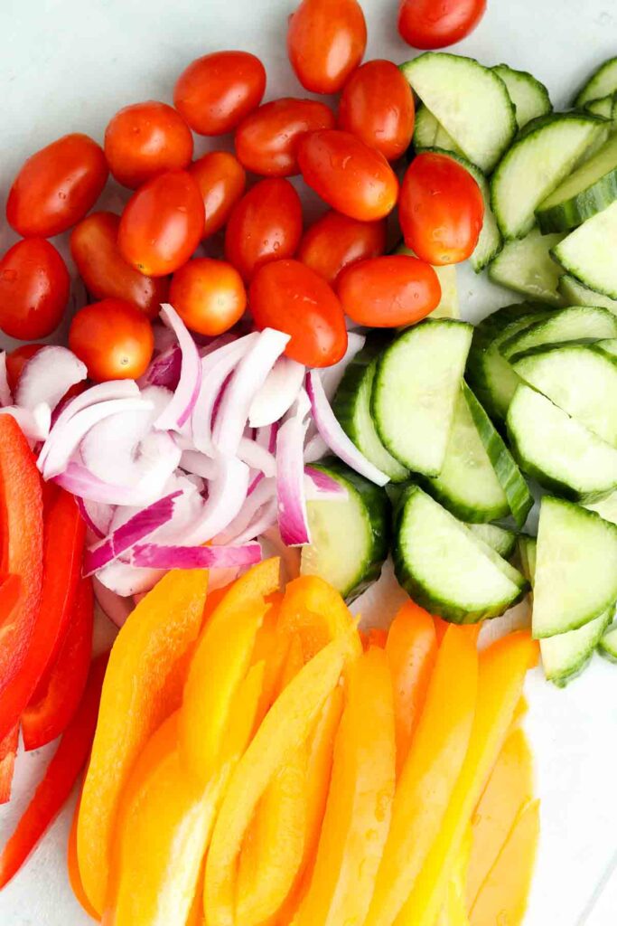 veggies on a cutting board for the salad