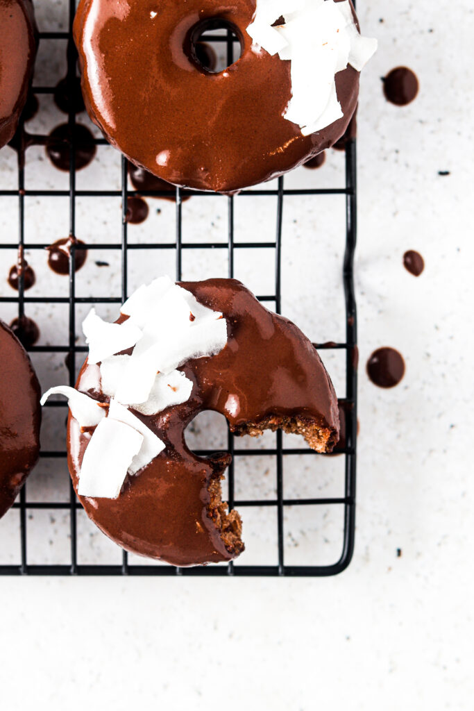 half eaten donut on a cooling rack