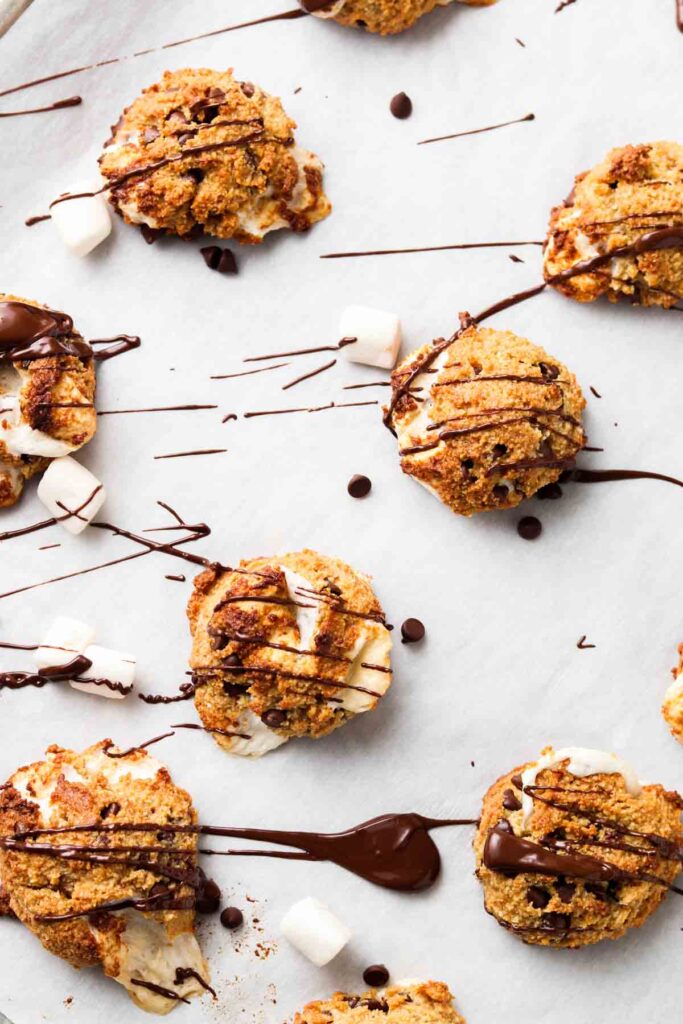 chocolate drizzled over cookies on a tray