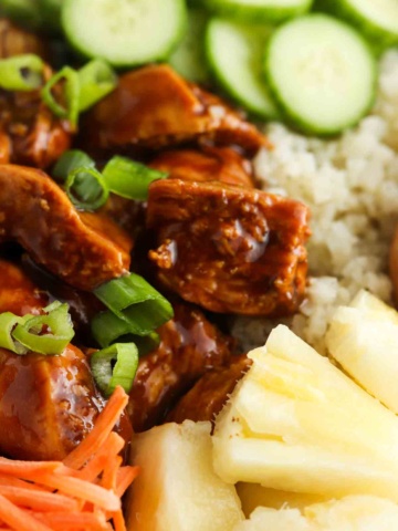 Marinated chicken, green onions, cucumbers, cauliflower rice and carrots all tossed together.