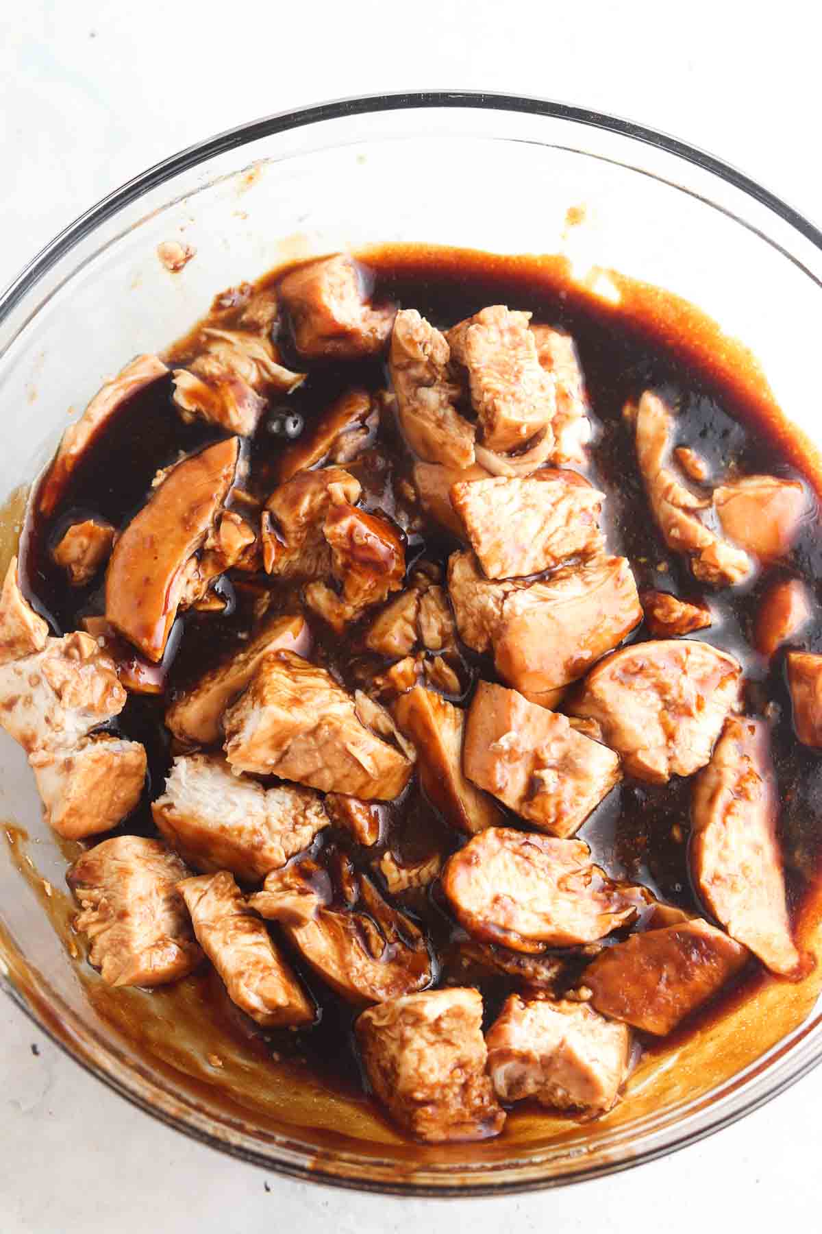 Marinate chicken in a large glass bowl.