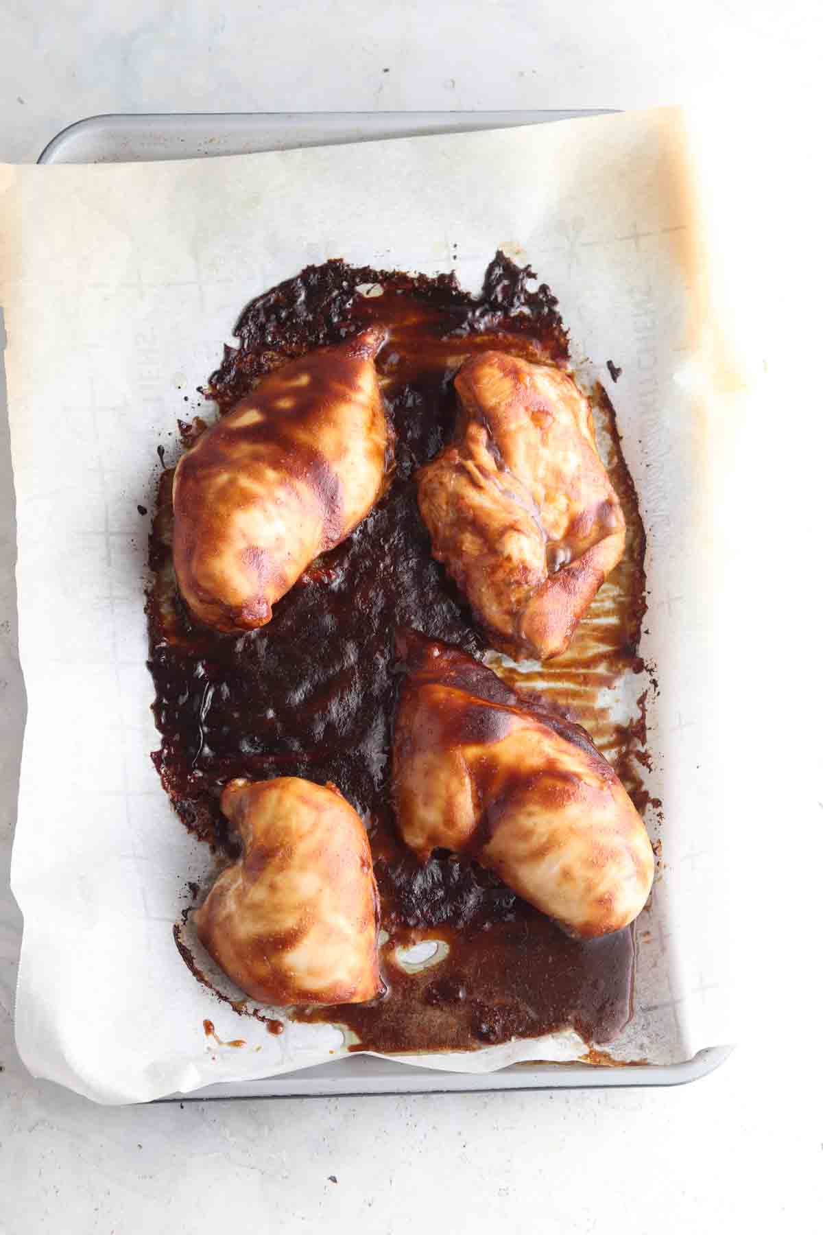 Marinate chicken on a sheet pan.