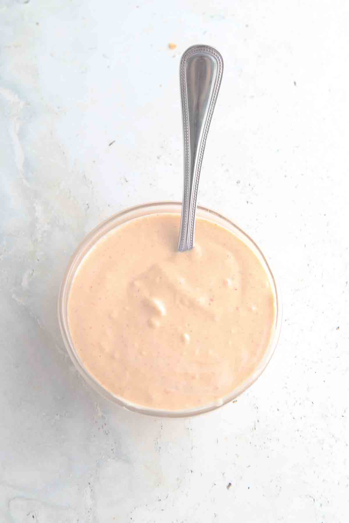 Spicy mayo ingredients in a small glass bowl.