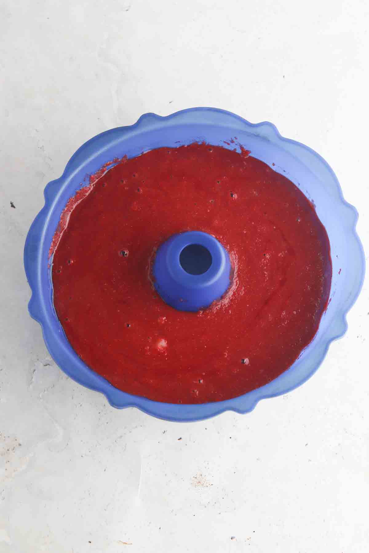 Cake ingredients in a silicone bundt pan. 