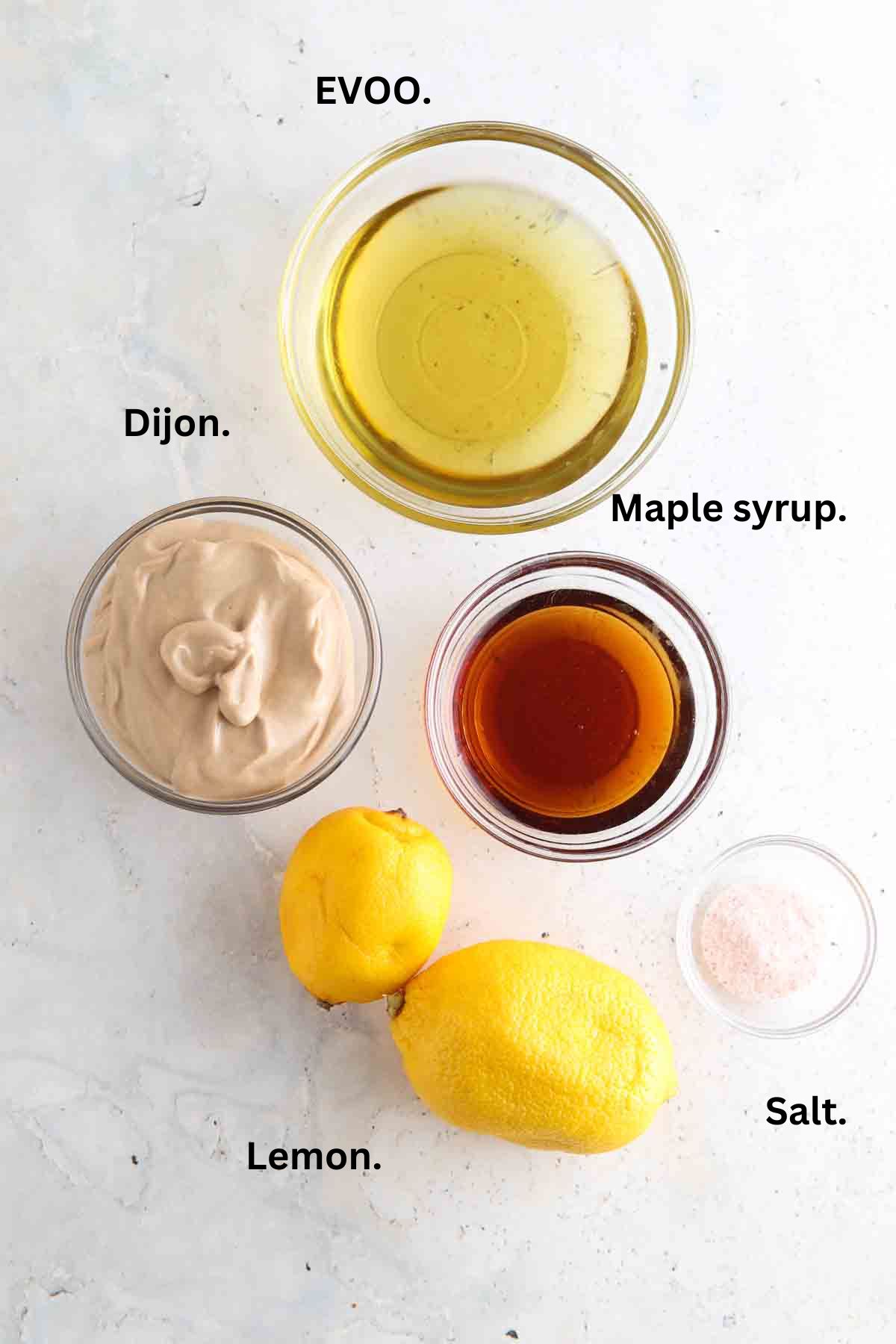 Dijon dressing ingredients laid out on the counter.