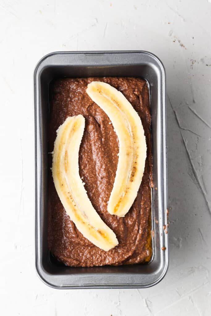 whole chocolate banana bread in a bread pan