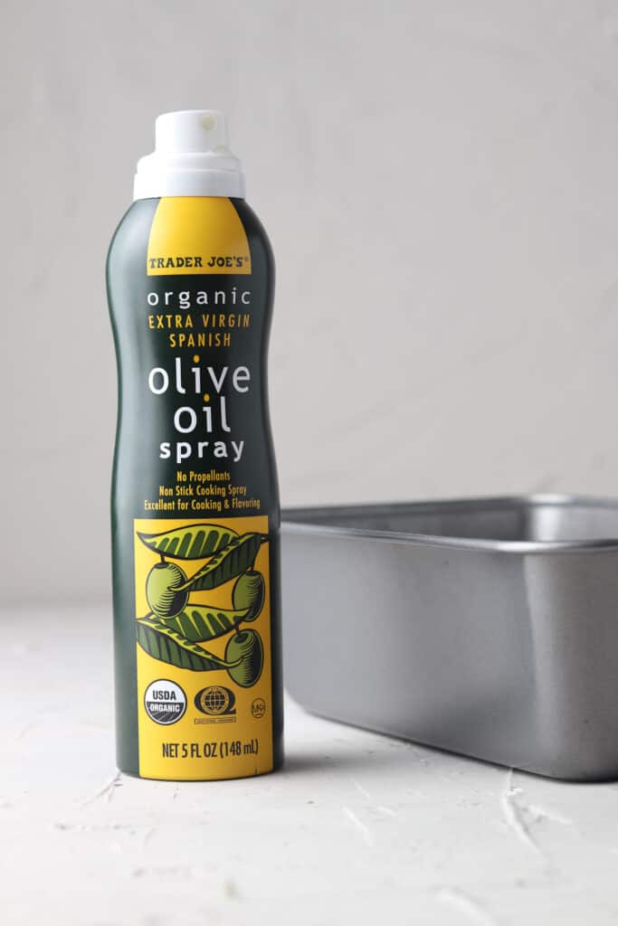 olive oil spray on a gray board for banana bread