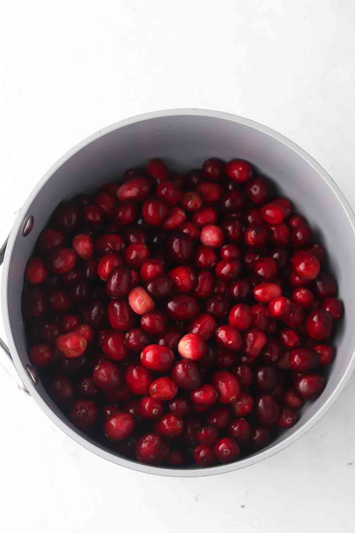 Fresh cranberries in a pot.