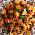 Butternut squash on a brown plate.