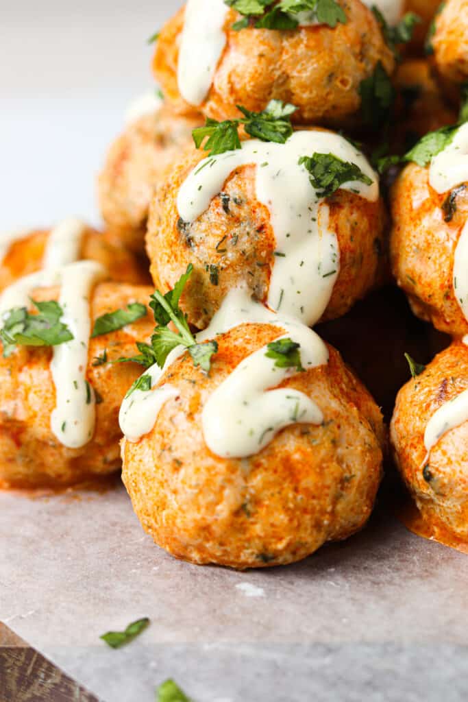 buffalo chicken meatballs stacked up with ranch dressing