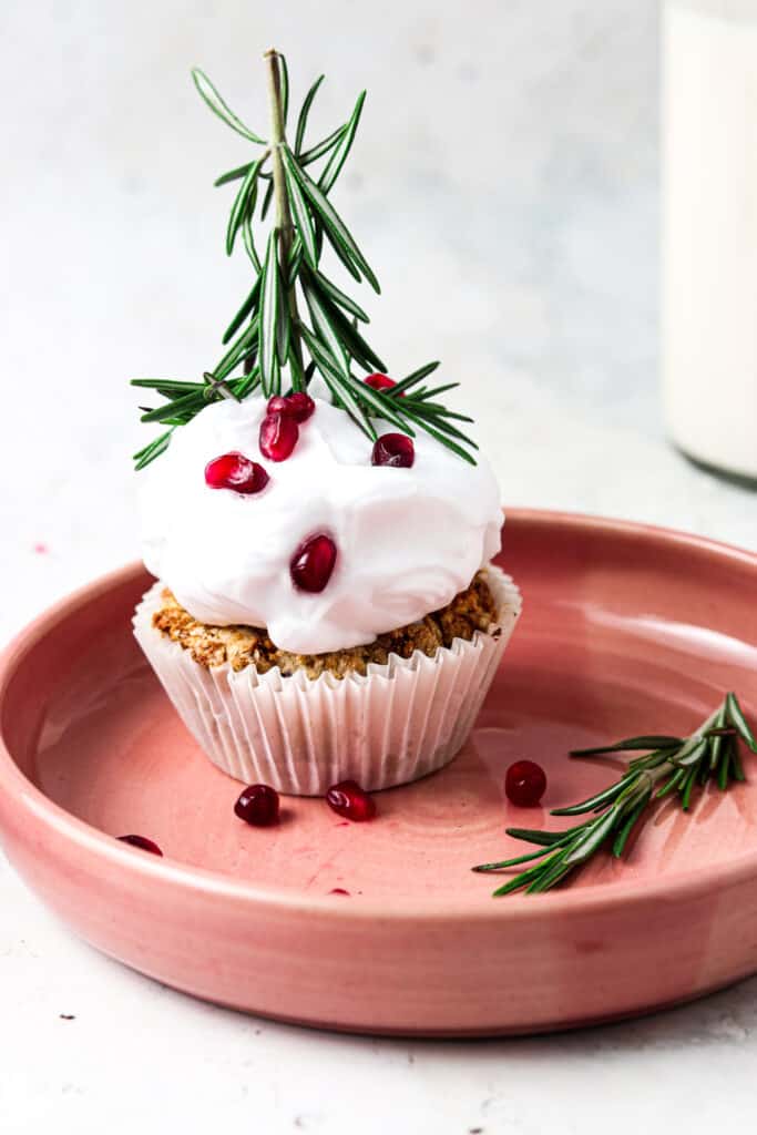 aip cupcakes on a pink plate with rosemary and pomegranate 