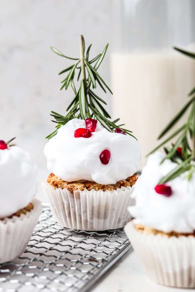 aip cupcakes on a metal serving platter with rosemary and coconut milk