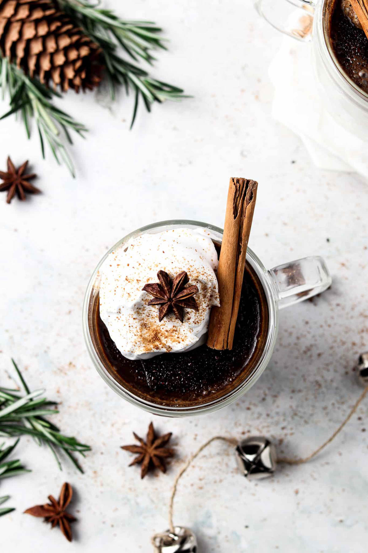 Dairy free hot chocolate with bells, cinnamon, and whole cloves.