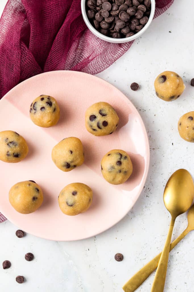 gluten free edible cookie dough on a pink plate with spoons