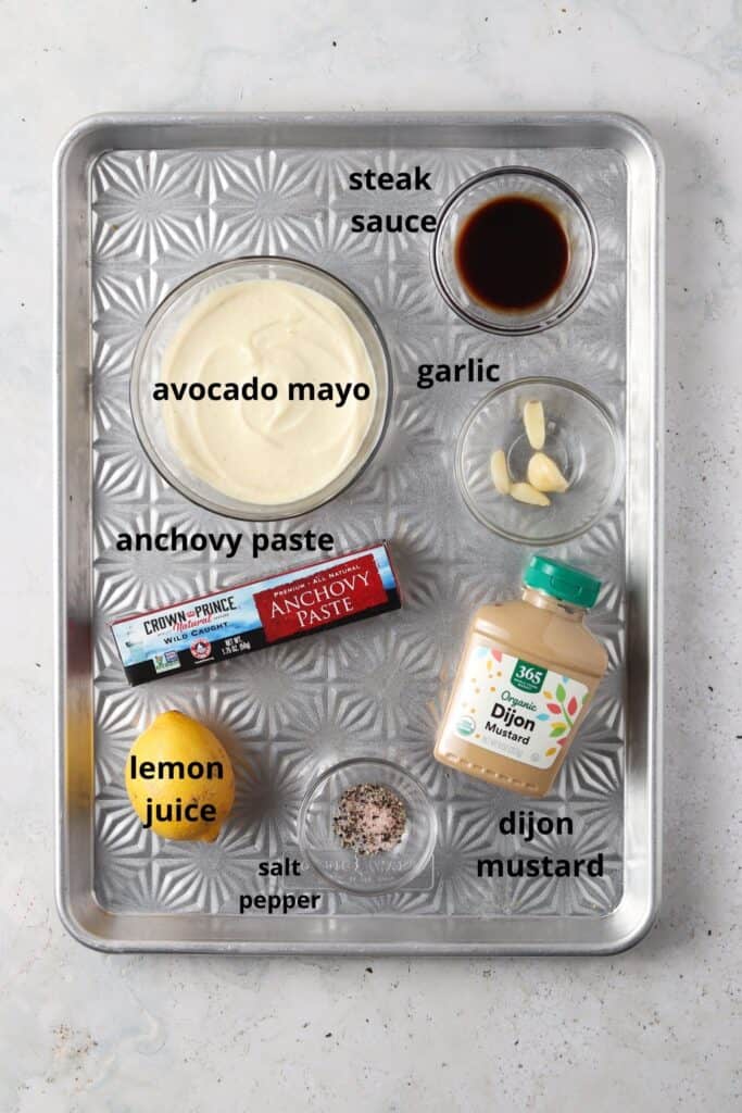whole30 caesar dressing ingredients on a silver metal tray