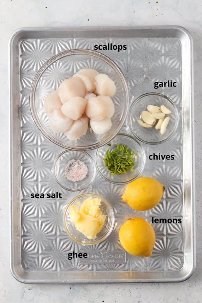 overhead shot of whole30 scallop ingredients on a metal tray