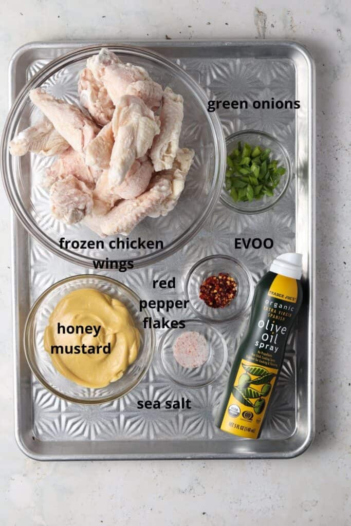 honey mustard chicken wings ingredients on a metal tray