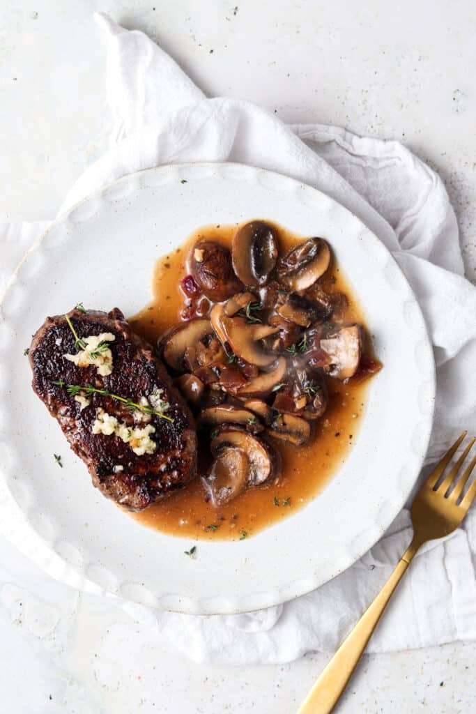 pan seared filet mignon on a grey plate