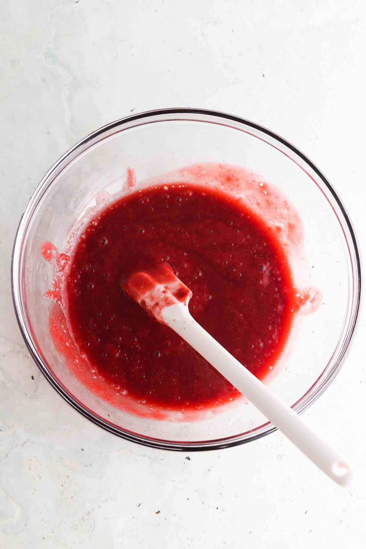 Bowl of seedless raspberry jam.