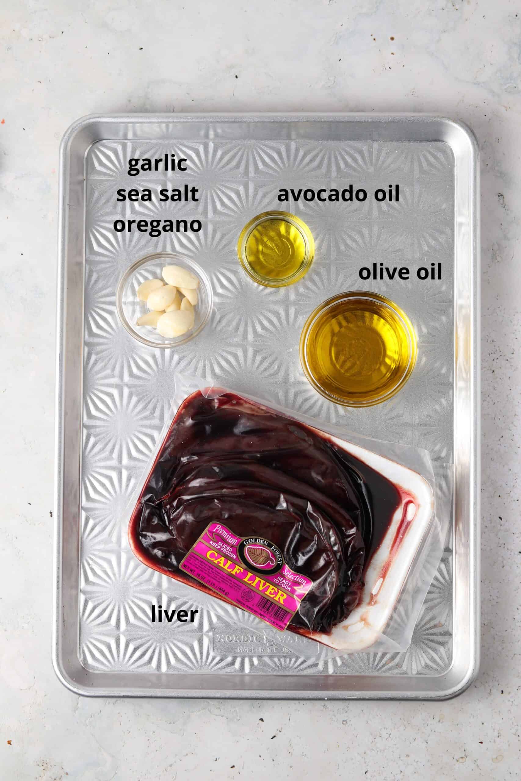 Pate ingredients in glass bowls on a metal tray.