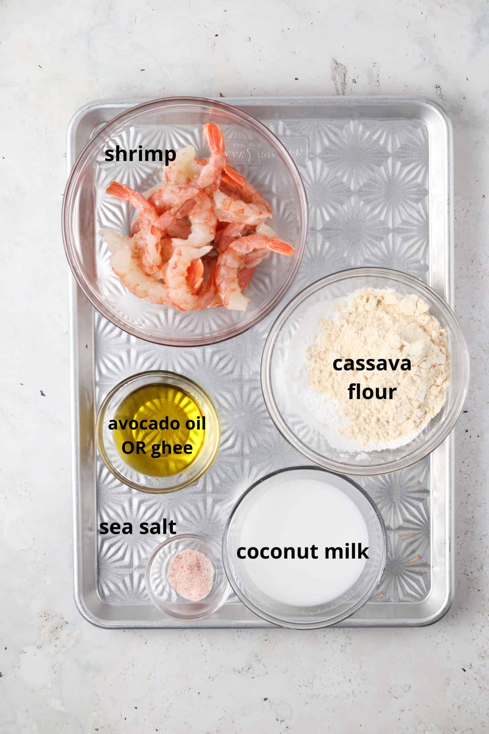 Gluten free fried shrimp ingredients in small glass bowls on a silver tray.