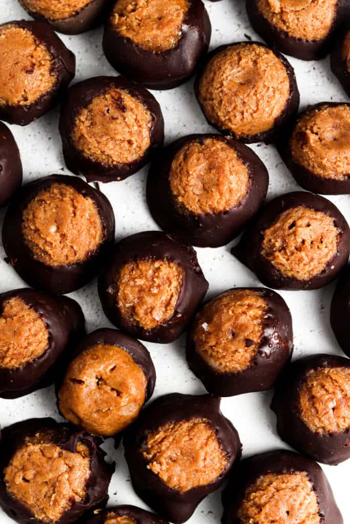 vegan buckeyes lined up on a sheet