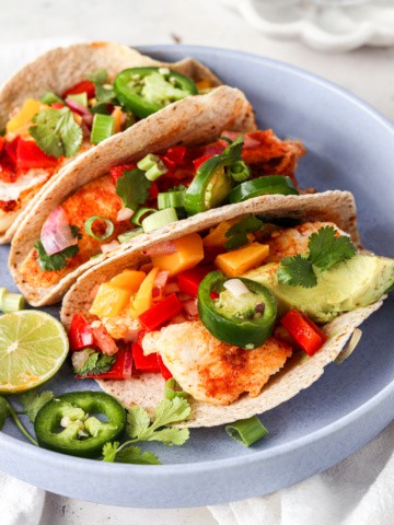 halibut fish tacos on a pale blue plate