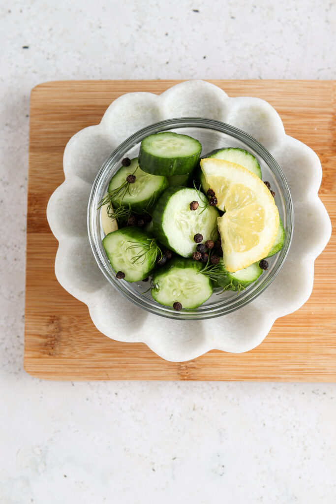 pretty picture of lemon cucumber pickles on a plate