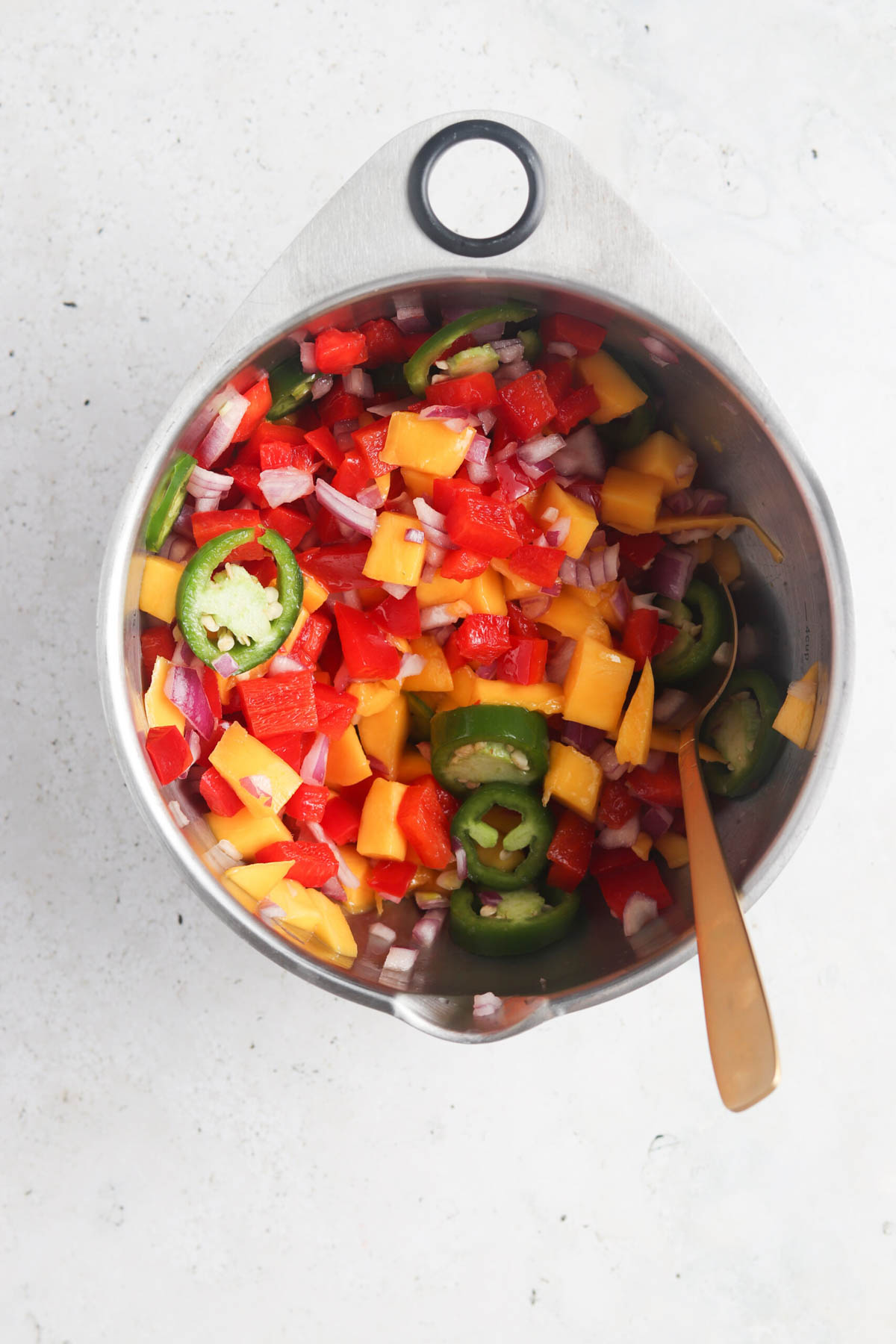 Pico de gallo in a large mixing bowl.