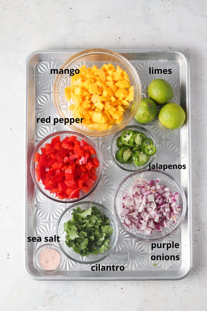 mango pico de gallo ingredients on a metal tray