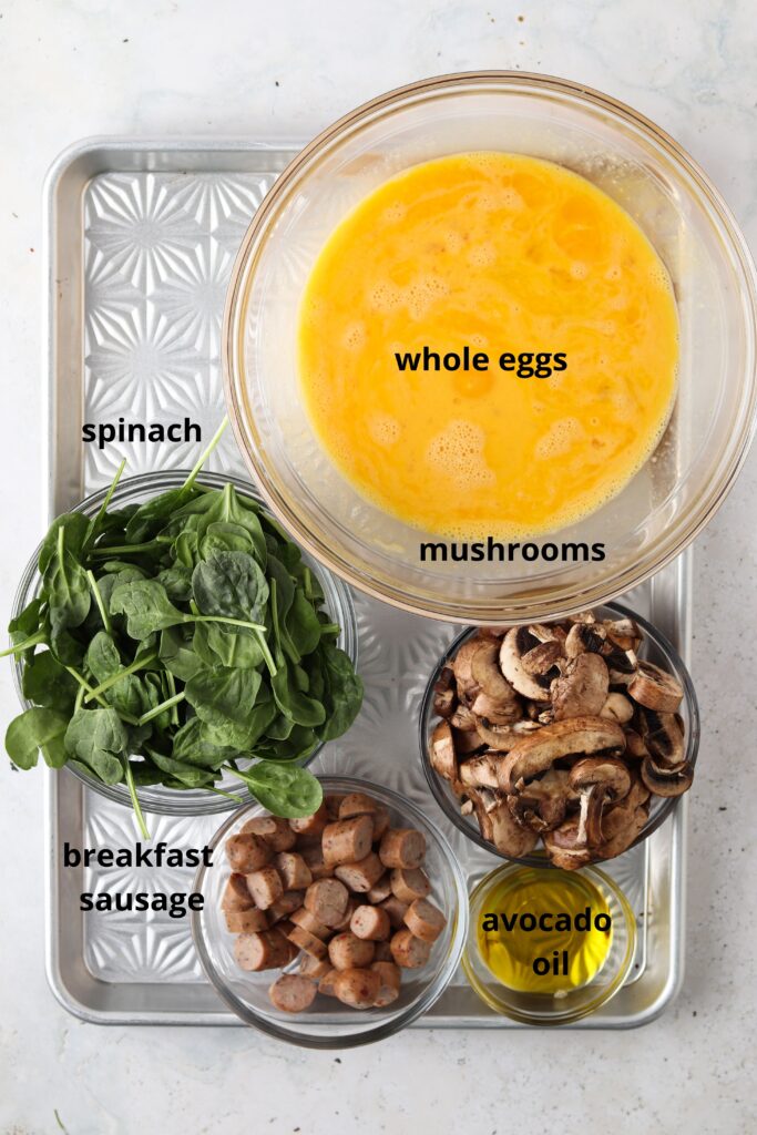 spinach mushroom frittata ingredients on a metal tray in bowls