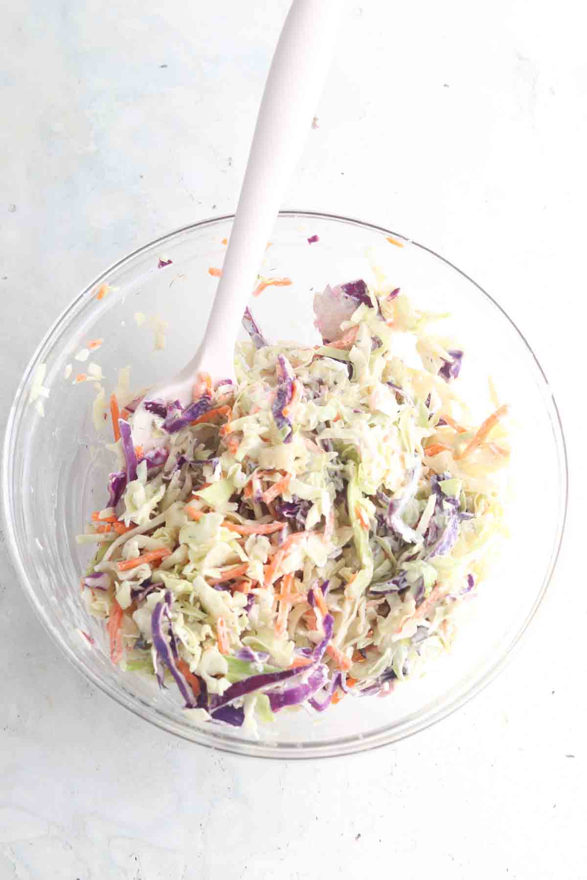 Coleslaw mixed in a large bowl.