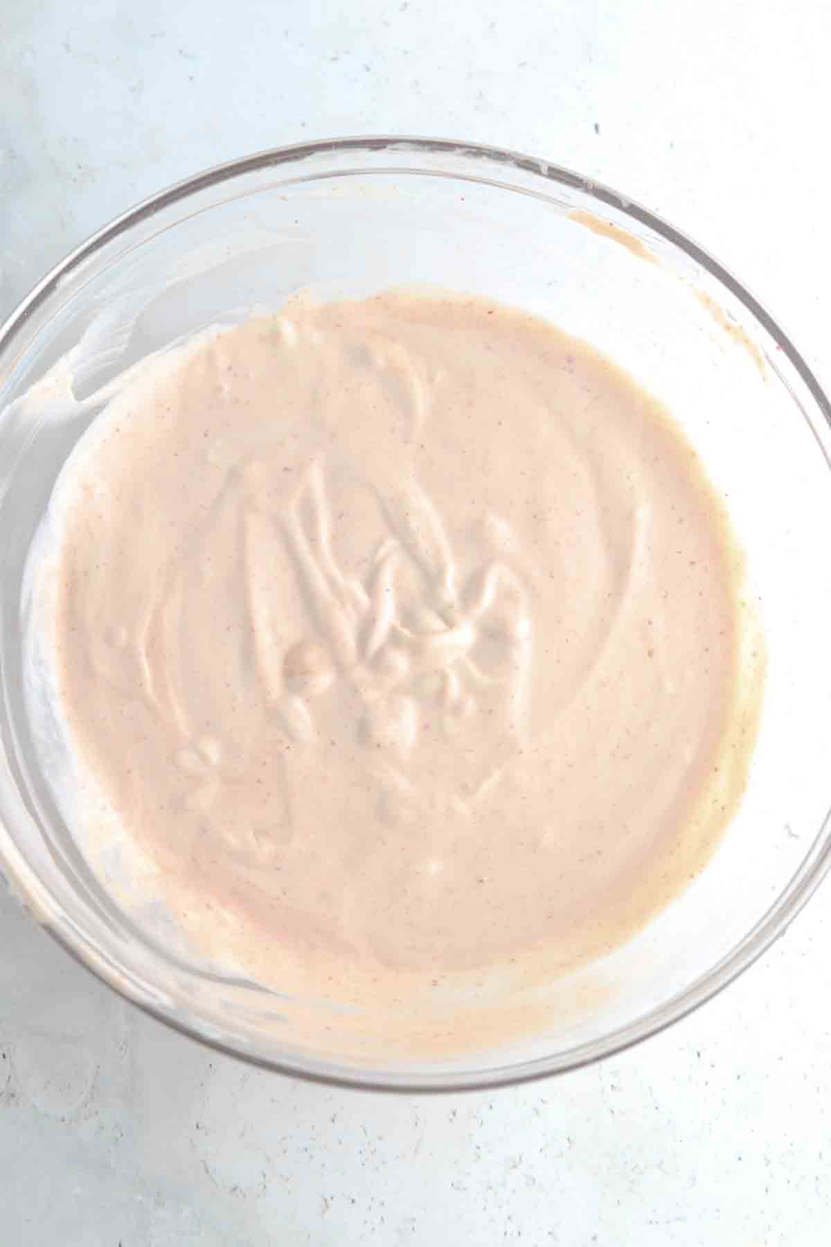 Spicy mayo sauce ingredients in a glass bowl.