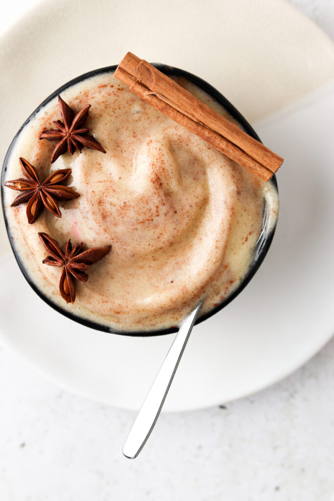banana nice cream in a bowl with cinnamon on top