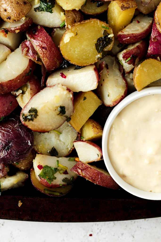 close up photo of potatoes with garlic aioli 