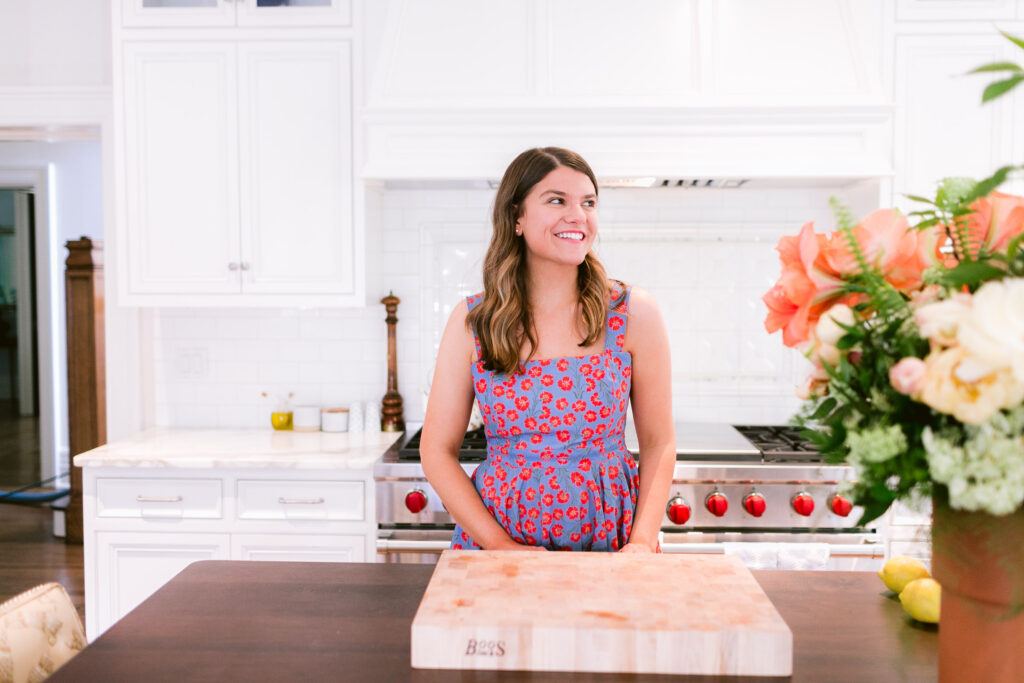 girl in a white kitchen looking to the right