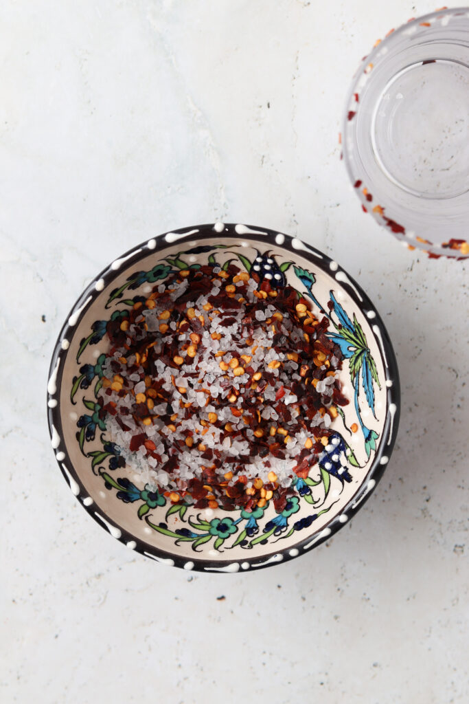 Sea salt and red pepper flakes combined in a Mexican bowls.