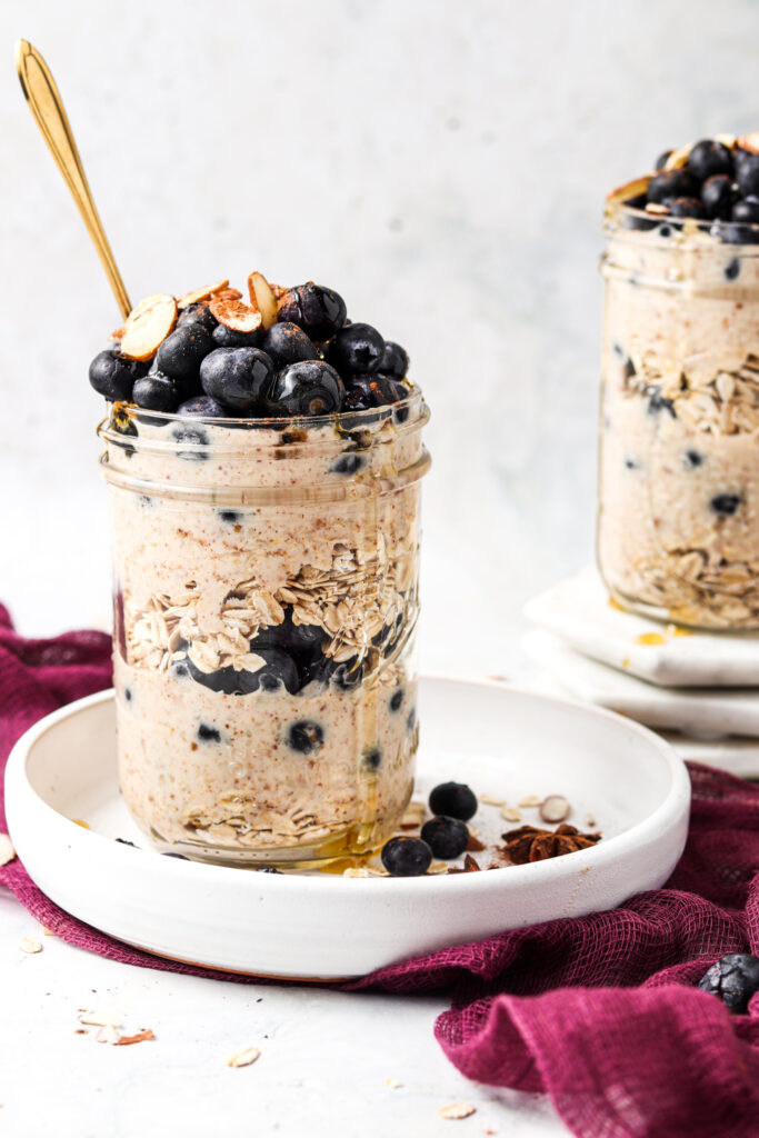 paleo overnight blueberry oats in a mason jar with blueberries