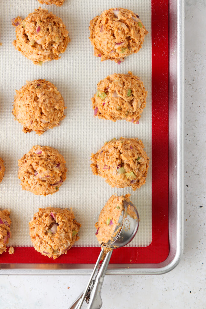 salmon cakes on a baking sheet