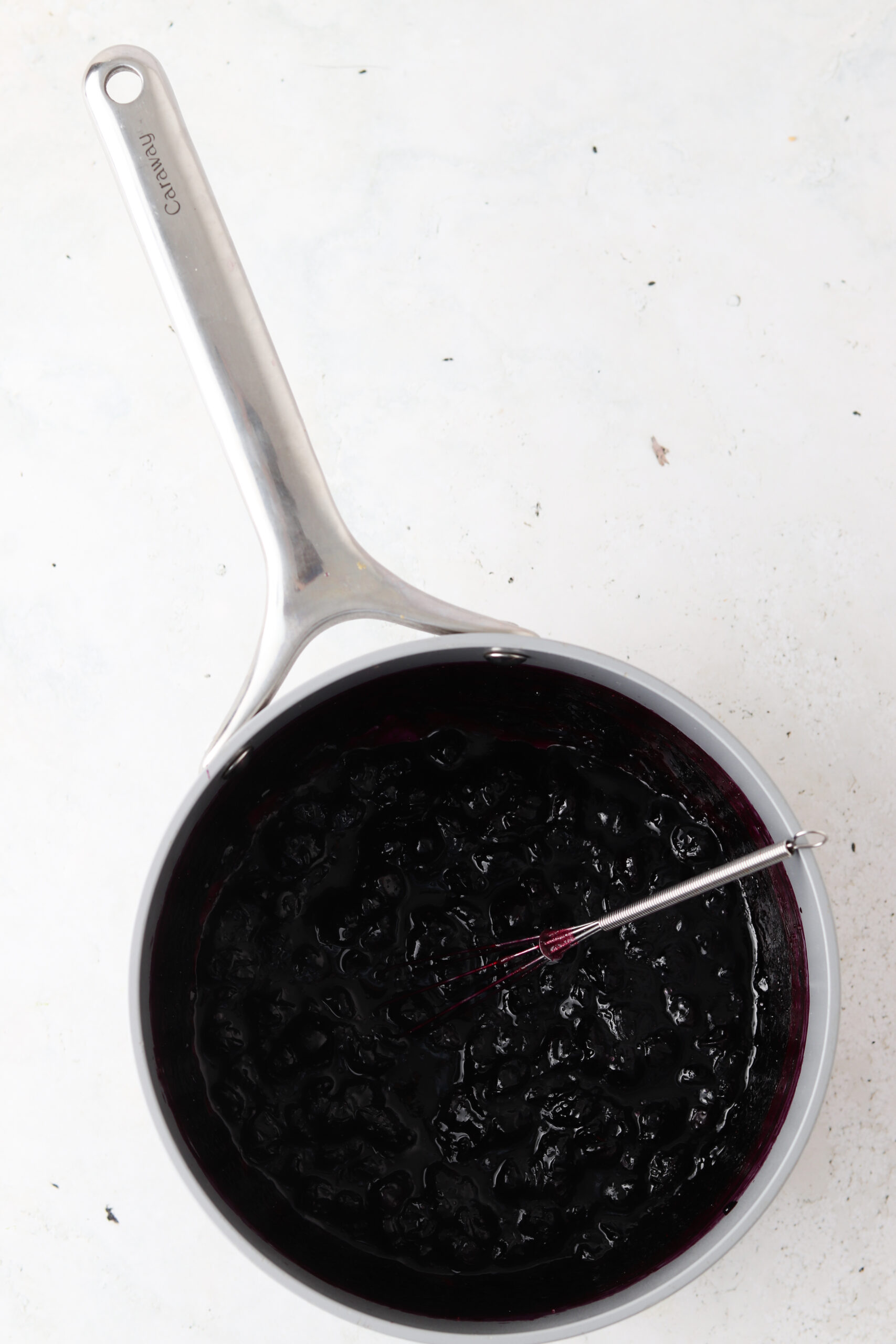 Blueberry maple jam ingredients in a saucepan.