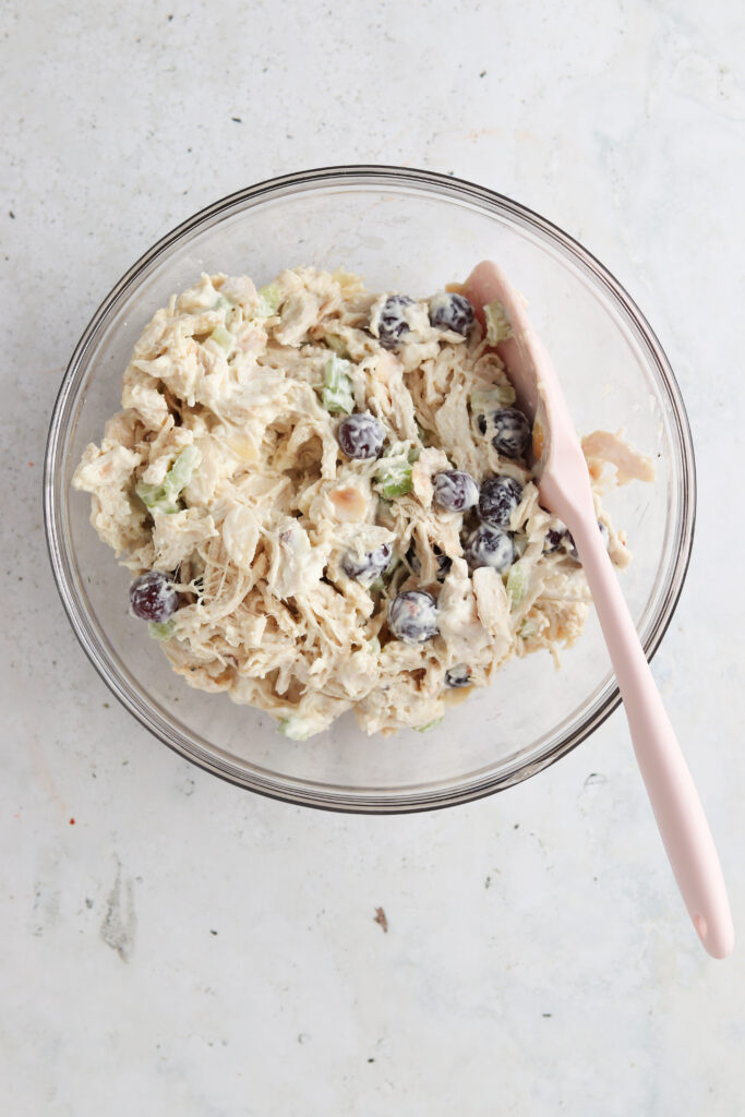 whole30 chicken salad ingredients in a bowl with a spoon
